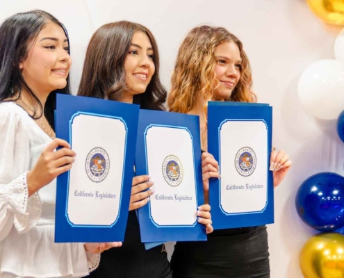 Three young participants proudly holding California Legislature certificates at a Fresno BHC Youth Internships Program recognition ceremony, showcasing youth leadership, community advocacy, and the opportunity for others to apply.