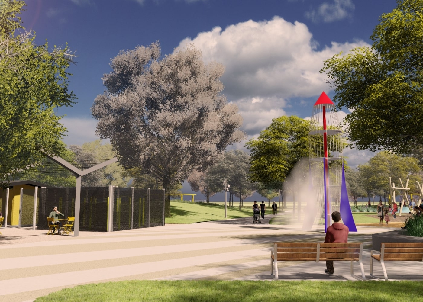 A wide park walkway with benches and trees, featuring a tall rocket-themed water play structure with mist spraying from below.