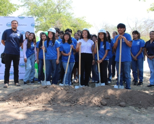 Group of youth and community leaders pose with shovels for a ceremonial dig at Calwa Park’s renovation launch.