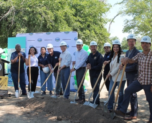 Diverse group of local officials and community leaders pose with shovels during Calwa Park Renovation groundbreaking in Fresno.