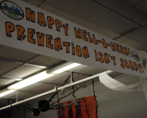 “Happy Well-O-Ween! Prevention Isn’t Scary!” banner hanging inside the Fresno BHC Halloween celebration