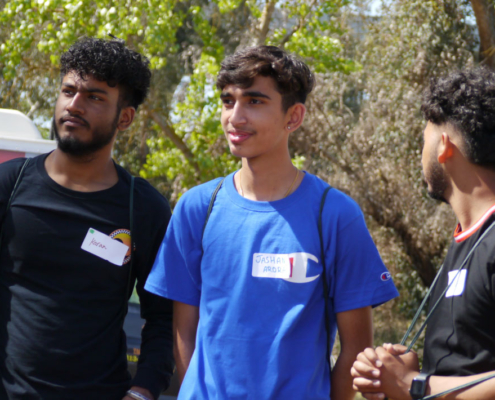 Youth interns from Fresno Building Healthy Communities discussing environmental justice and the CEMEX Quarry project