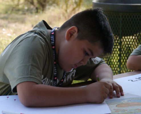Fresno BHC student participant drawing posters for the campaign against the CEMEX Quarry Expansion in Fresno