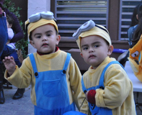 Two young children dressed as Minions enjoying Fresno BHC’s family-friendly Well-O-Ween celebration