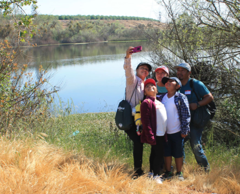 Fresno family taking a selfie by the San Joaquin River during Fresno BHC’s #River4All environmental education event