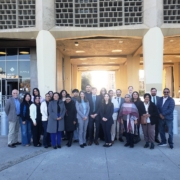 Did Caltrans Shortchange South Fresno? Judge Weighs Highway 99 Expansion Lawsuit A wide group portrait of about twenty people of diverse ages and backgrounds standing in front of a modern "Court House Entrance." They are dressed in a mix of professional and business-casual attire. The courthouse features a unique concrete honeycomb-style facade.