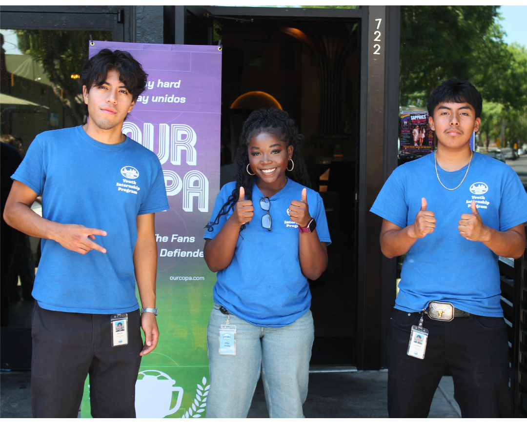 Three young people in blue 